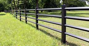 A black fence made of square tubing.